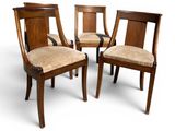 three wooden chairs with upholstered seats and a beige upholstered seat