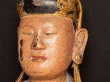 a statue of a man with a hat on his head