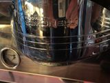 a large silver pot sitting on top of a counter