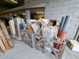 a pile of boxes and crates in a garage