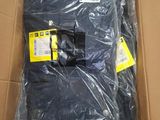 a cardboard box with a black shirt inside of it