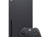 a black xbox console next to a game controller