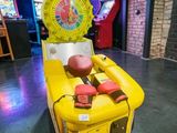 a game machine that is sitting in the middle of a room