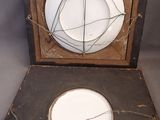 a white plate sitting on top of a wooden box