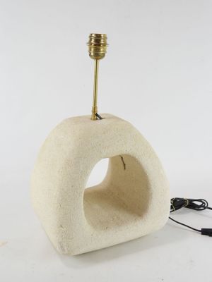 a light that is sitting on top of a stone structure