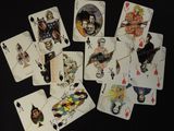 a lot of playing cards that are on a table