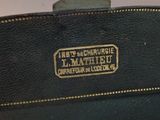 a black purse with a gold logo on it
