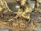 a bronze sculpture of a group of people in a boat