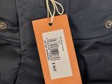 a close up of a jacket with a tag on it
