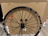 a bicycle wheel that is sitting on the floor