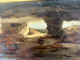 a picture of a painting of a man and a dog in a cave
