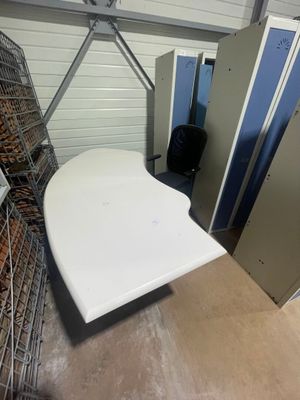 a white table in the middle of a room