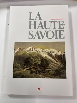 the book la haute savoie is sitting on a table