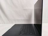 an image of a black laptop on a white surface