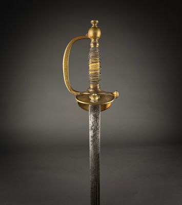 a gold and silver sword on a black background