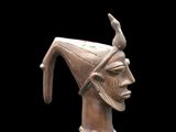 an image of a bronze statue of a man with a bird on his head