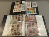 a lot of stamps on a table with a book