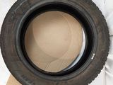 a tire sitting on top of a sheet of paper
