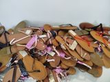 many pairs of shoes that are on a table