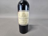 a bottle of wine that is sitting on a table