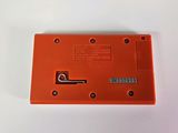 a close up of an orange plastic device on a white surface