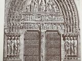 an old black and white photo of a church door with statues on it