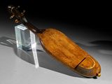 a wooden instrument that is sitting on a table