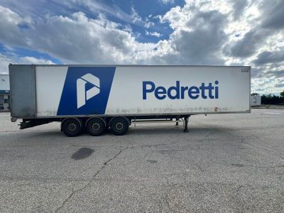 a picture of a semi trailer parked in a parking lot