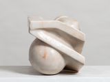 a white sculpture that is on top of a table