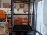 a refrigerator that has a glass door in it