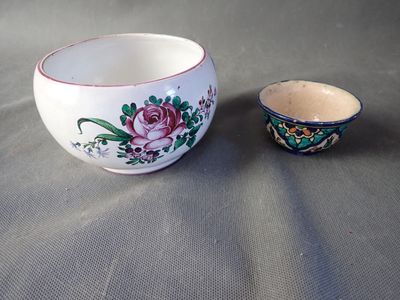 a small bowl and a small bowl sitting on a table
