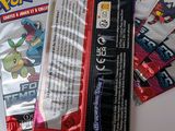 a lot of pokemon cards sitting on top of a table