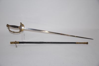 an old sword with a wooden handle on a white surface