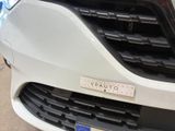 a close up of the front of a white car