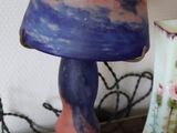 two vases sitting on a table next to each other