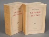two books sitting on top of each other on top of a table