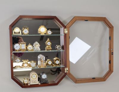 a mirror that is on the wall above a clock
