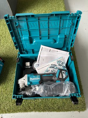 a blue tool box with tools in it on the floor