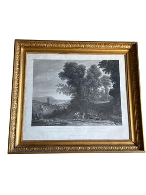 une photo d'un tableau représentant un paysage dans un cadre doré