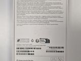 the back of a white box with a green sticker on it