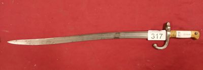 a picture of a sword that is on a red surface