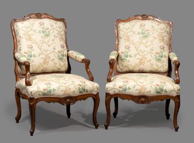 pair of louis xv style carved walnut armchairs