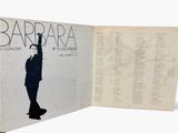 an open book with a picture of a man in a suit on it