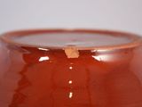 a close up of a brown vase with a white background