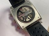 a close up of a watch on a black strap