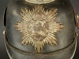 a close up of a helmet with a gold star on it