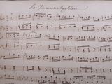 an old sheet of music that is being displayed on a table
