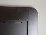 a black television sitting on top of a white wall