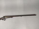 a gun that is sitting on top of a table