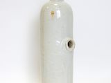 two white vases sitting next to each other on a white surface